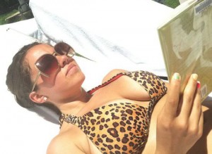 Pardon the boob shot! Here we have some poolside nutritional reading material!